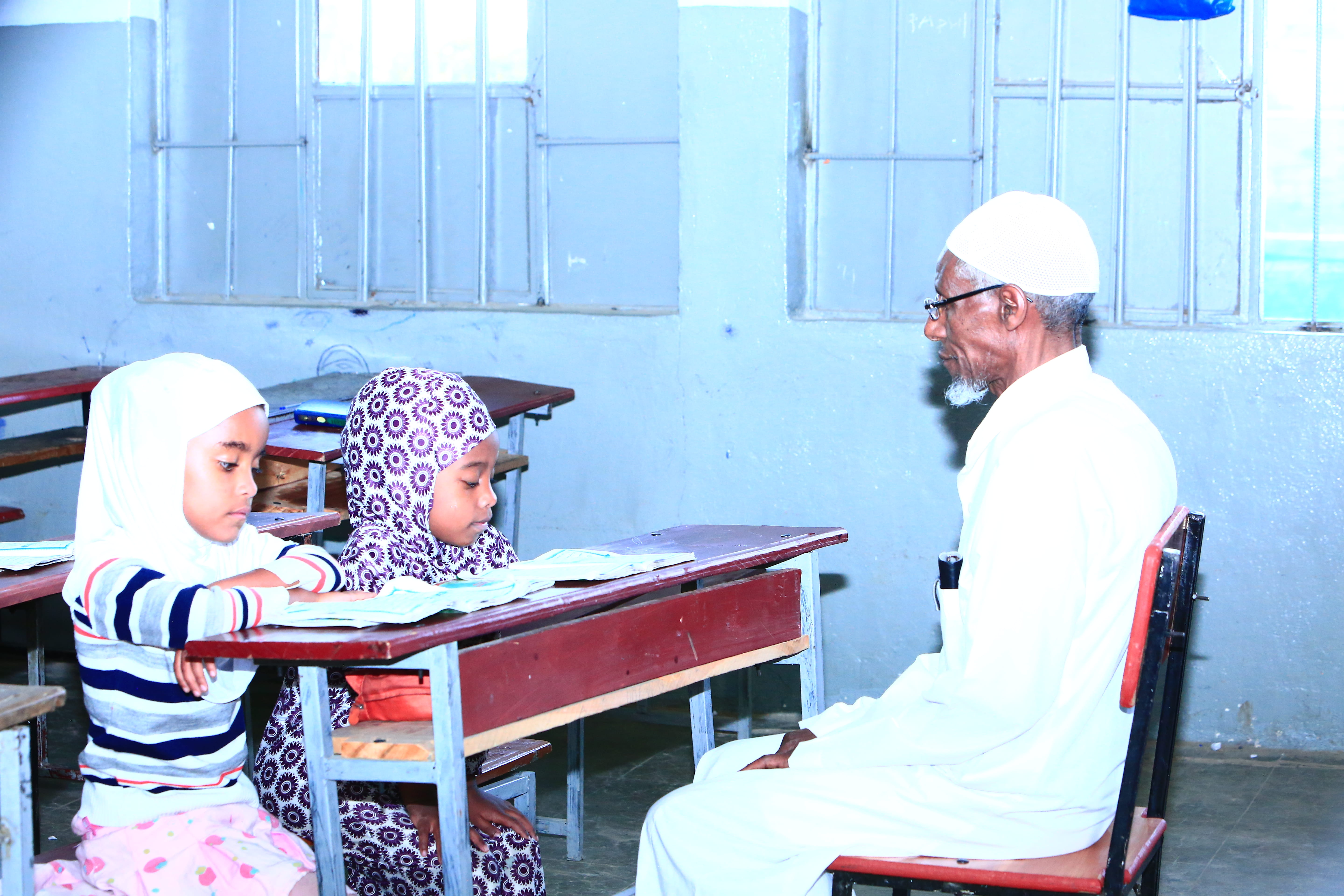 Teacher conducting Islamic teaching session